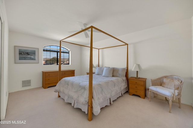 bedroom with light colored carpet and ceiling fan