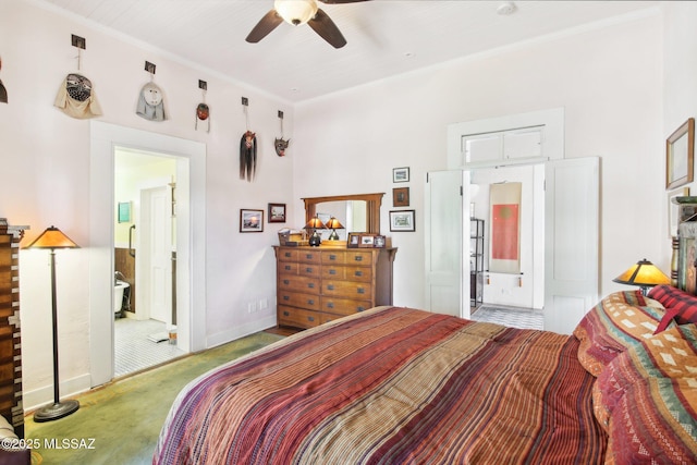 carpeted bedroom with ceiling fan, ensuite bathroom, and ornamental molding