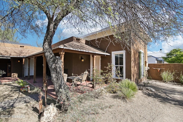 view of front of property with a patio