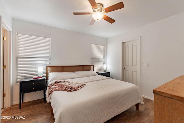 bedroom featuring ceiling fan and dark hardwood / wood-style flooring