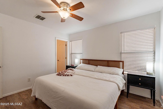 bedroom featuring ceiling fan and dark hardwood / wood-style flooring