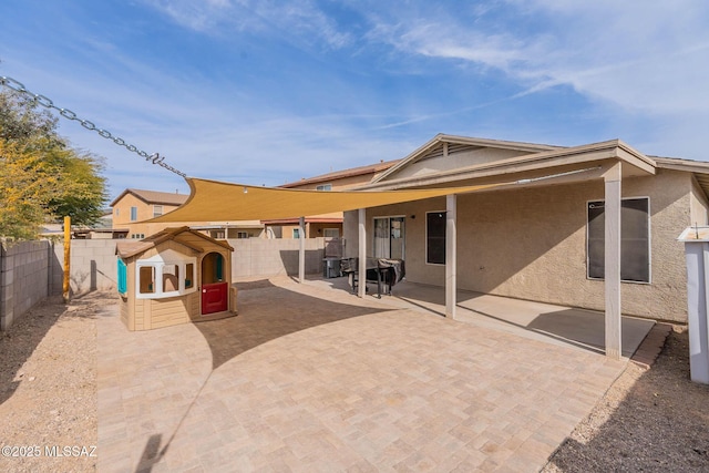 rear view of house with a patio