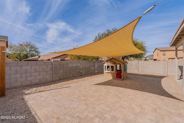 view of patio featuring a playground