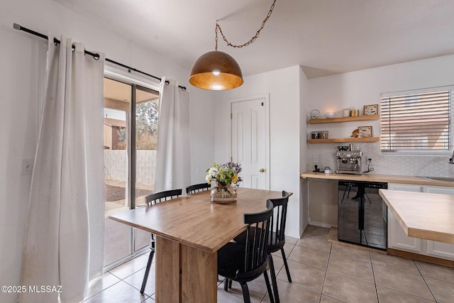 dining area with sink and light tile patterned floors