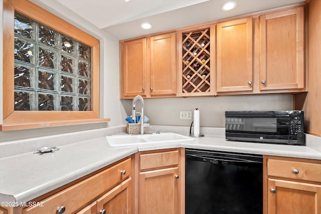 kitchen with a toaster, recessed lighting, a sink, light countertops, and dishwasher