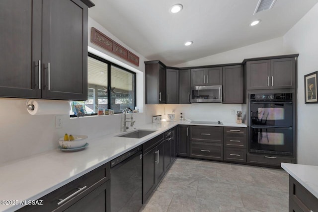 kitchen with black appliances, vaulted ceiling, dark brown cabinets, and sink