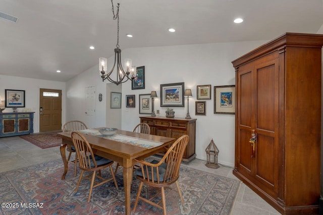 dining room with vaulted ceiling