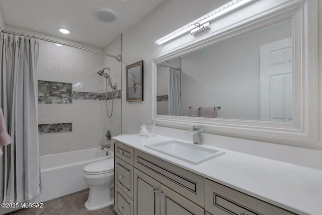 full bathroom featuring toilet, vanity, and shower / tub combo