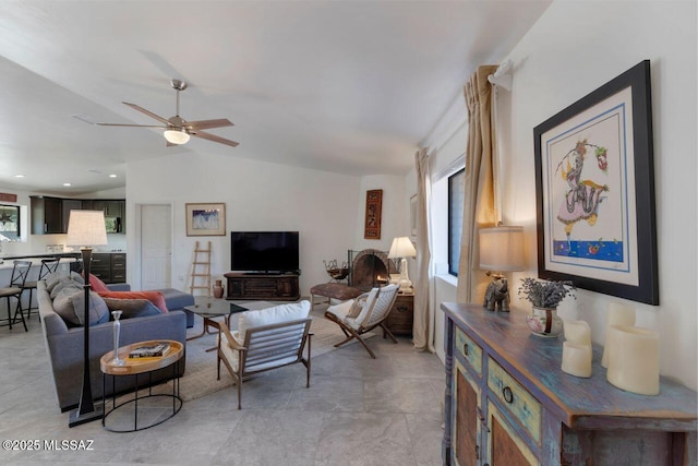 living room featuring vaulted ceiling and ceiling fan