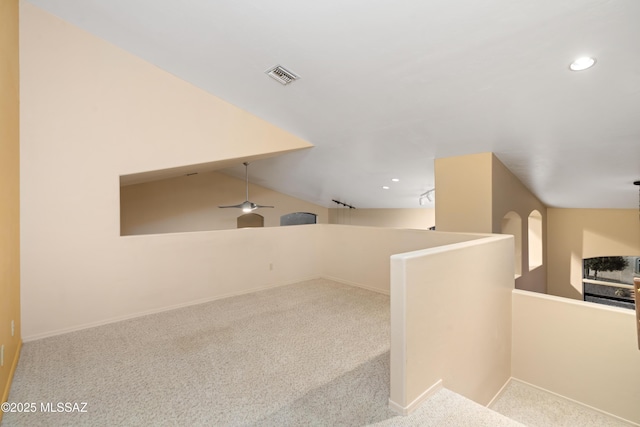 interior space with light colored carpet and ceiling fan