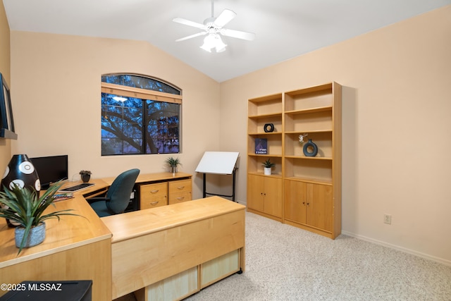 carpeted office featuring ceiling fan and lofted ceiling