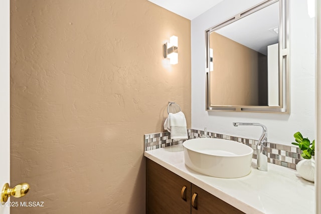 bathroom featuring backsplash and vanity