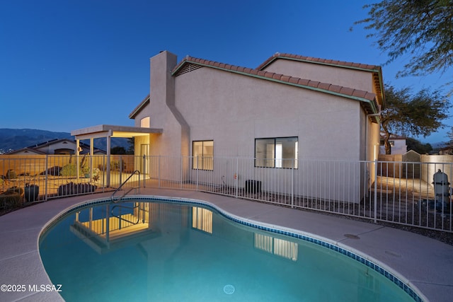 view of pool with a patio area and a mountain view