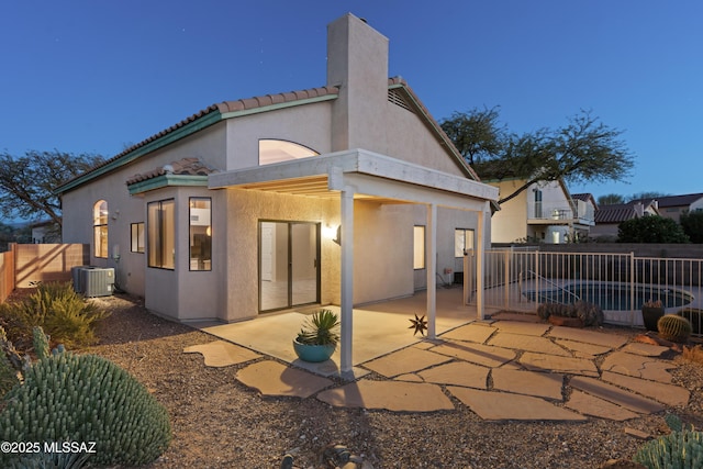 back of house featuring a patio and central AC unit