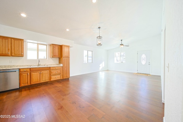 kitchen with dark hardwood / wood-style floors, dishwasher, a healthy amount of sunlight, and pendant lighting