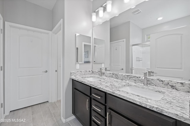 bathroom featuring vanity and walk in shower