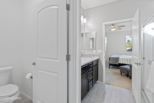 bathroom with vanity, ceiling fan, and toilet