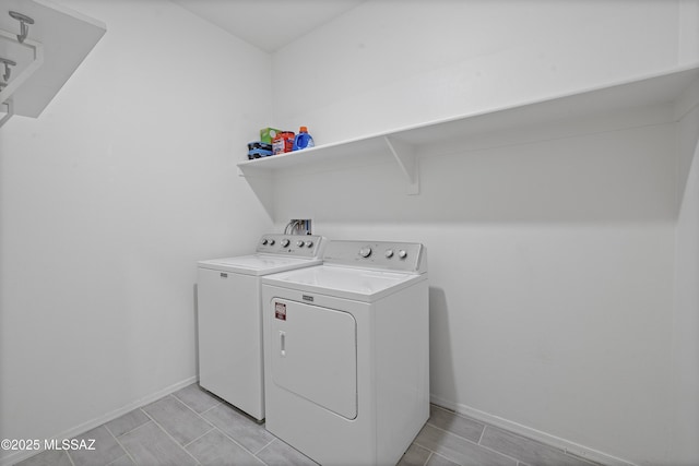 washroom featuring washer and dryer