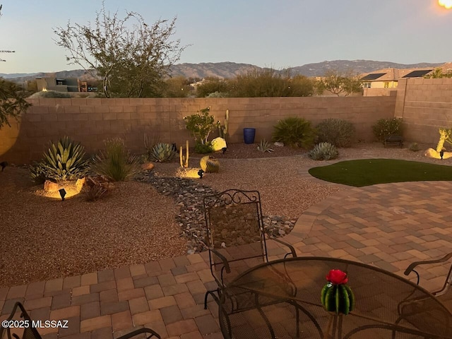 view of patio / terrace featuring a mountain view