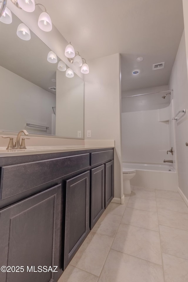 full bathroom featuring vanity, bathing tub / shower combination, tile patterned floors, and toilet