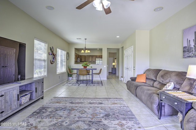 living room with light tile patterned floors and ceiling fan