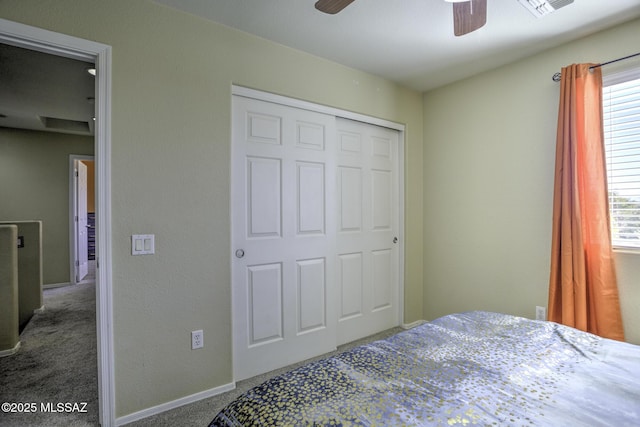 bedroom featuring ceiling fan, carpet flooring, and a closet