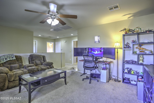 home office with ceiling fan and light colored carpet