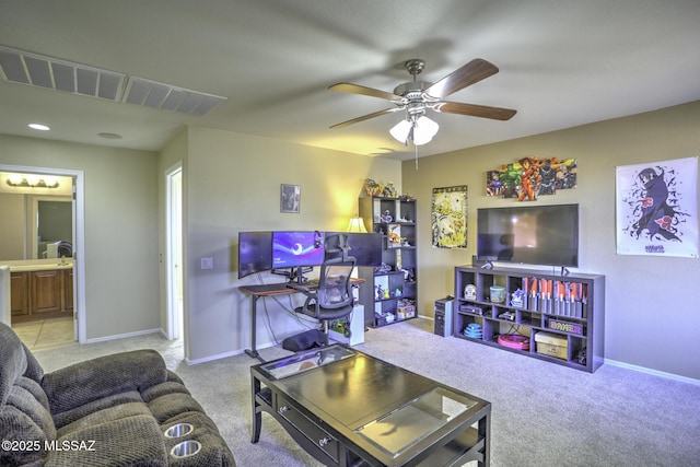 living room with ceiling fan and light colored carpet