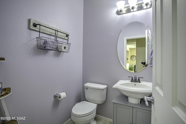 bathroom with sink and toilet