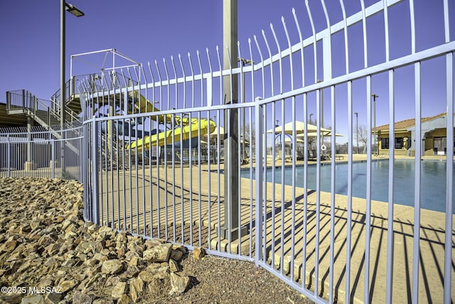 view of gate featuring a water view