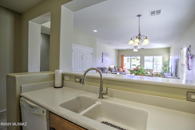 kitchen with ceiling fan, white dishwasher, sink, and hanging light fixtures