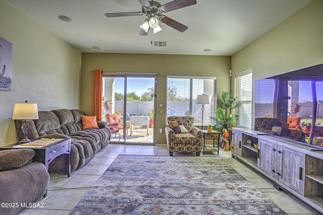 living room with light tile patterned floors and ceiling fan