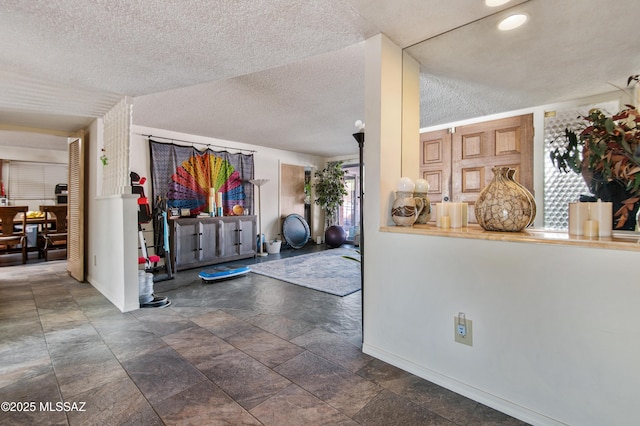 entryway featuring a textured ceiling