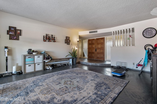 interior space with a textured ceiling