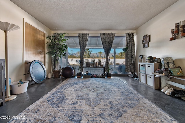 sitting room featuring a textured ceiling and a wealth of natural light