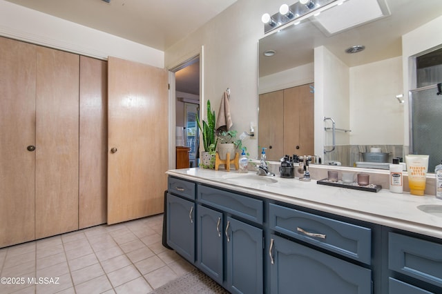 bathroom featuring vanity and tile patterned flooring