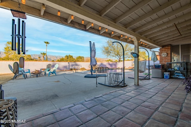 view of patio / terrace featuring an outdoor fire pit