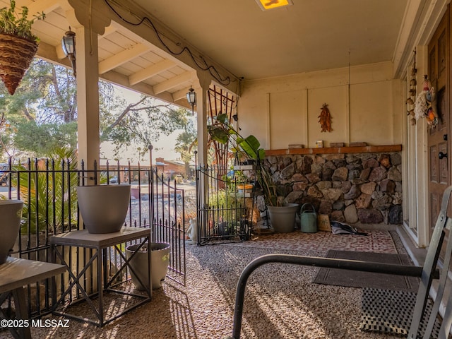 patio terrace at dusk featuring a balcony