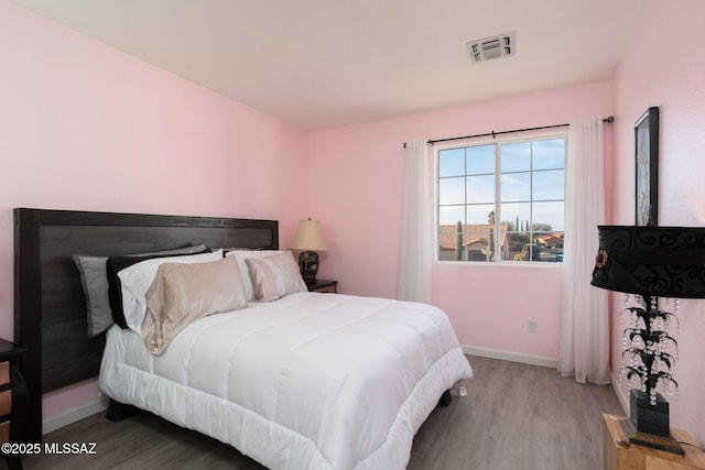 bedroom featuring light hardwood / wood-style flooring