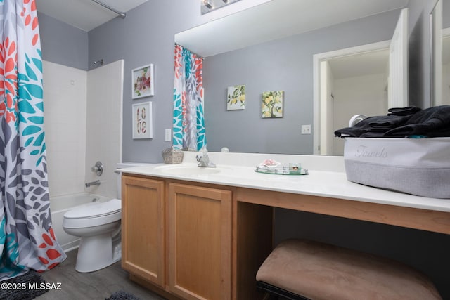 full bathroom featuring vanity, shower / bathtub combination with curtain, and toilet