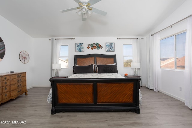 bedroom featuring light hardwood / wood-style floors and ceiling fan