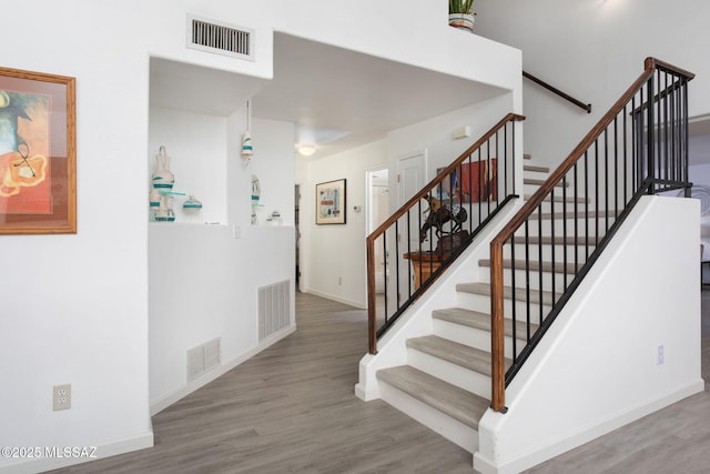 stairway with wood-type flooring