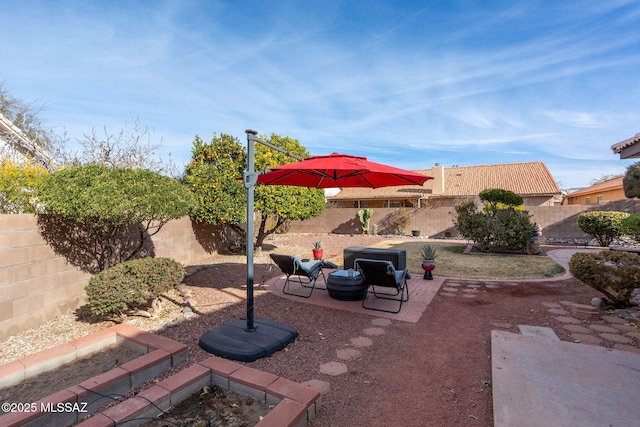 view of patio featuring a fire pit