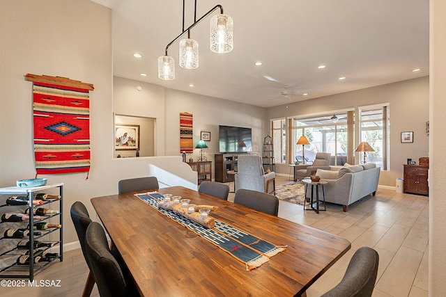 dining room featuring ceiling fan and light wood-type flooring