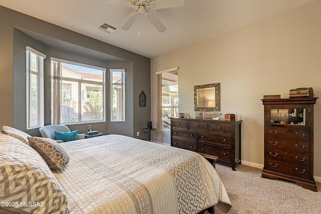 bedroom with light colored carpet and ceiling fan