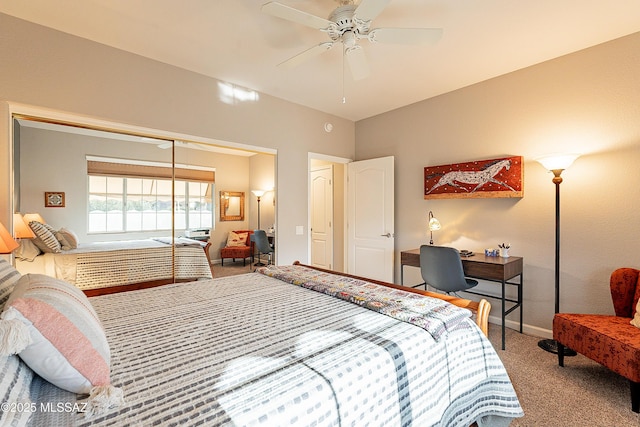 carpeted bedroom featuring ceiling fan and a closet