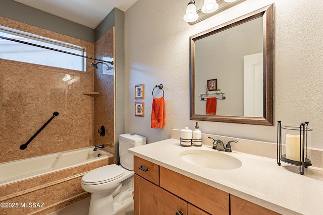 full bathroom featuring vanity, toilet, and tiled shower / bath combo