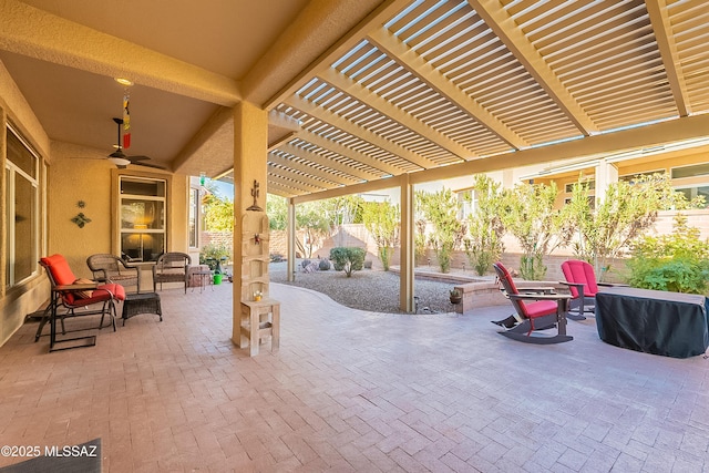 view of patio / terrace with an outdoor living space, a pergola, and ceiling fan