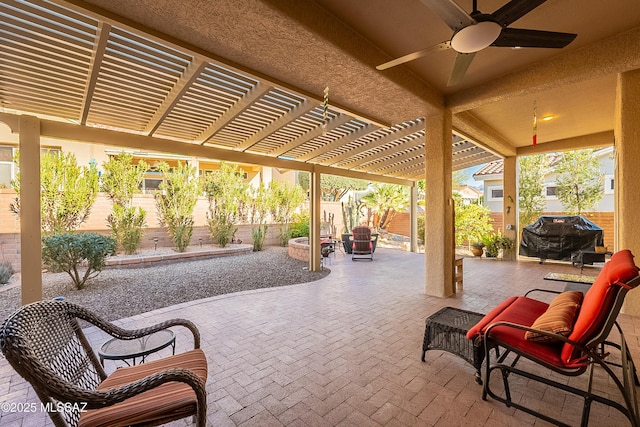 view of patio / terrace with a grill and a pergola