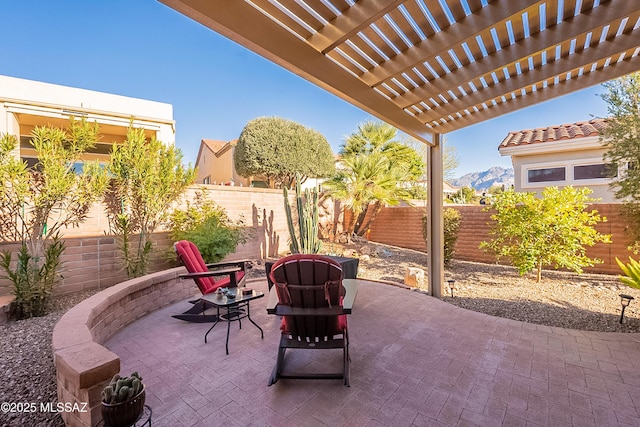 view of patio featuring a mountain view and a pergola